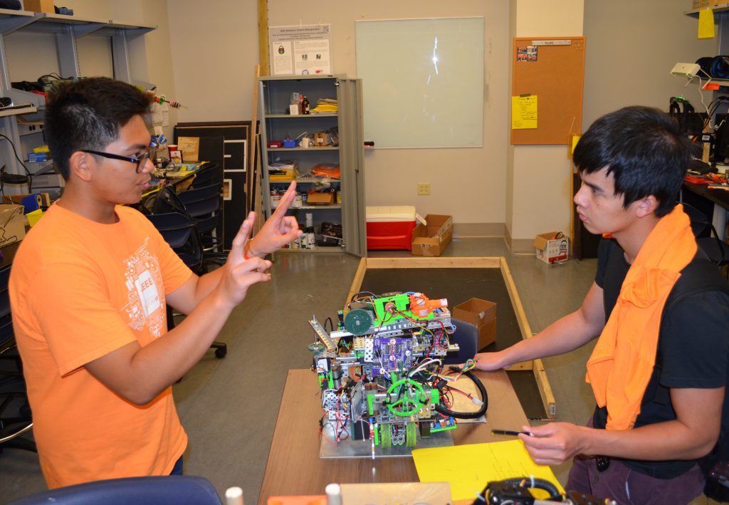 Students work with Robot in Min Kao Lab