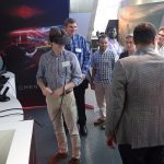 Co-host Shawn Wilson has UTK students try out some virtual reality in the Omen gaming products section at HP Inc.'s Customer Welcome Center. — in Palo Alto, California.