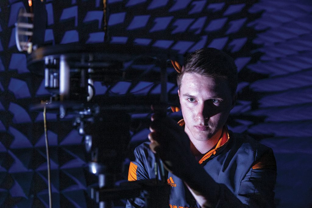 UT graduate student Chandler Bauder examining a wideband antenna for testing in an anechoic chamber that will be used extensively in the proposed 5G antennas evaluation.
