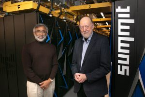 Zacharia, left, and Dongarra stand in front of ORNL’s Summit supercomputer.
