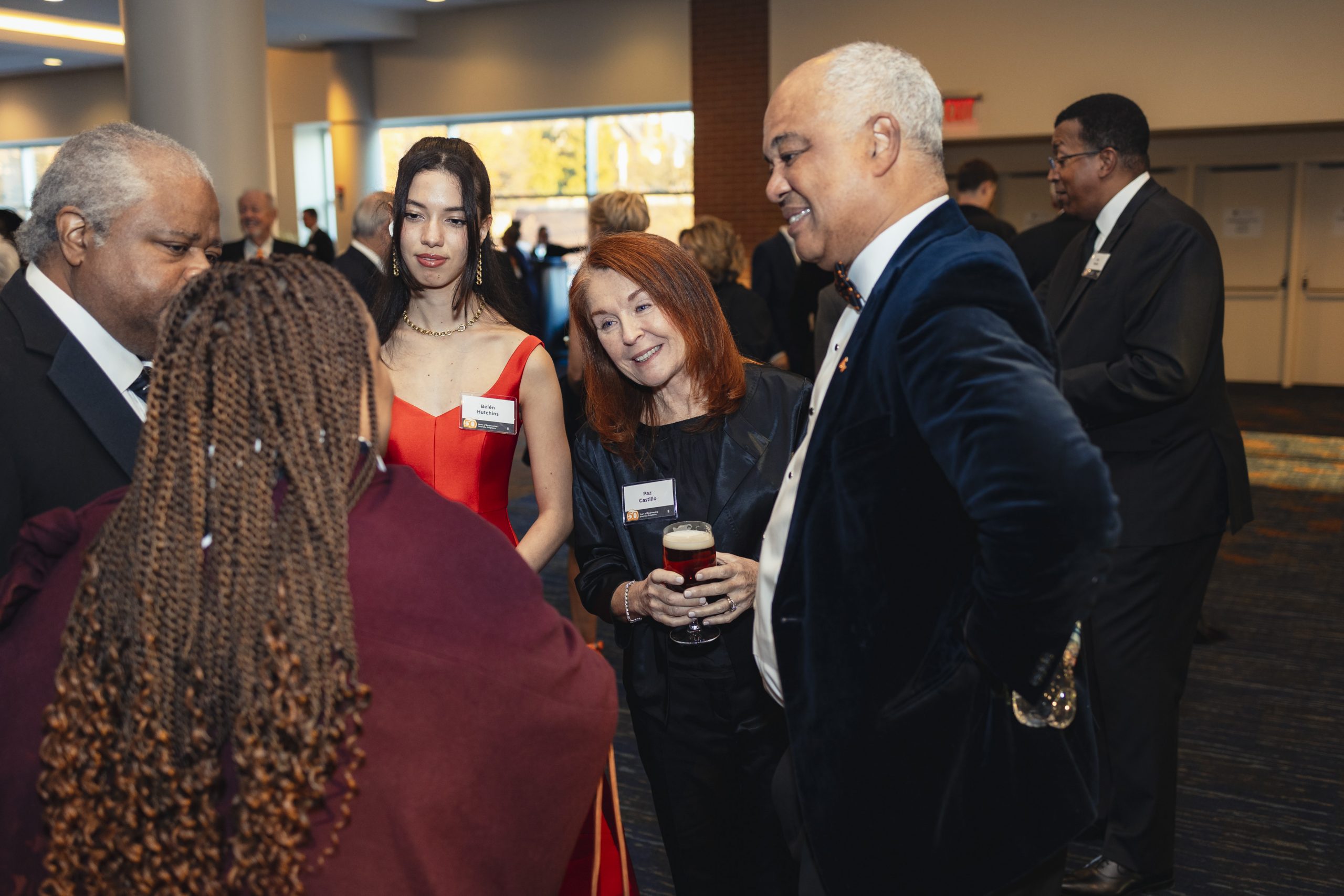 Dwight Hutchins mingling with other people at the EDP 50th Gala