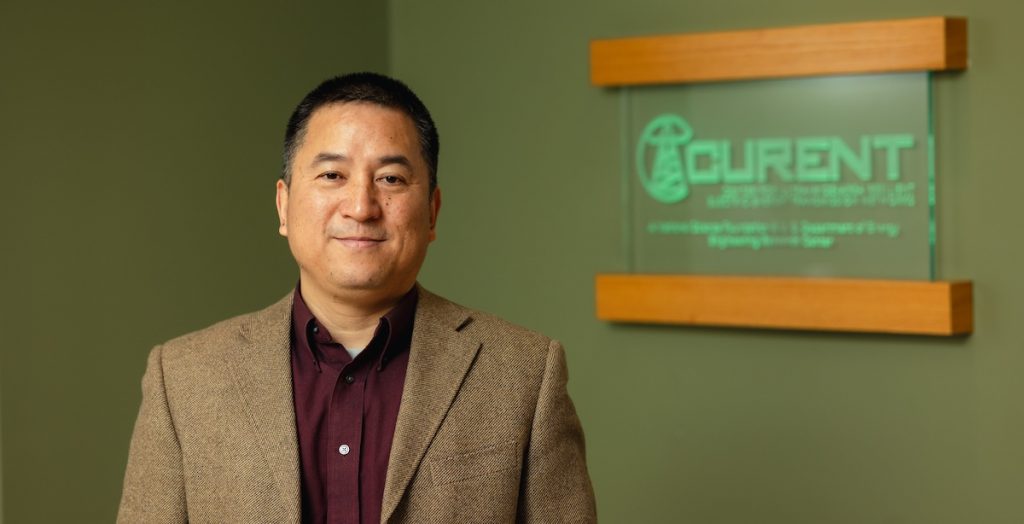 Dr. Fran Li standing in front of the CURENT sign