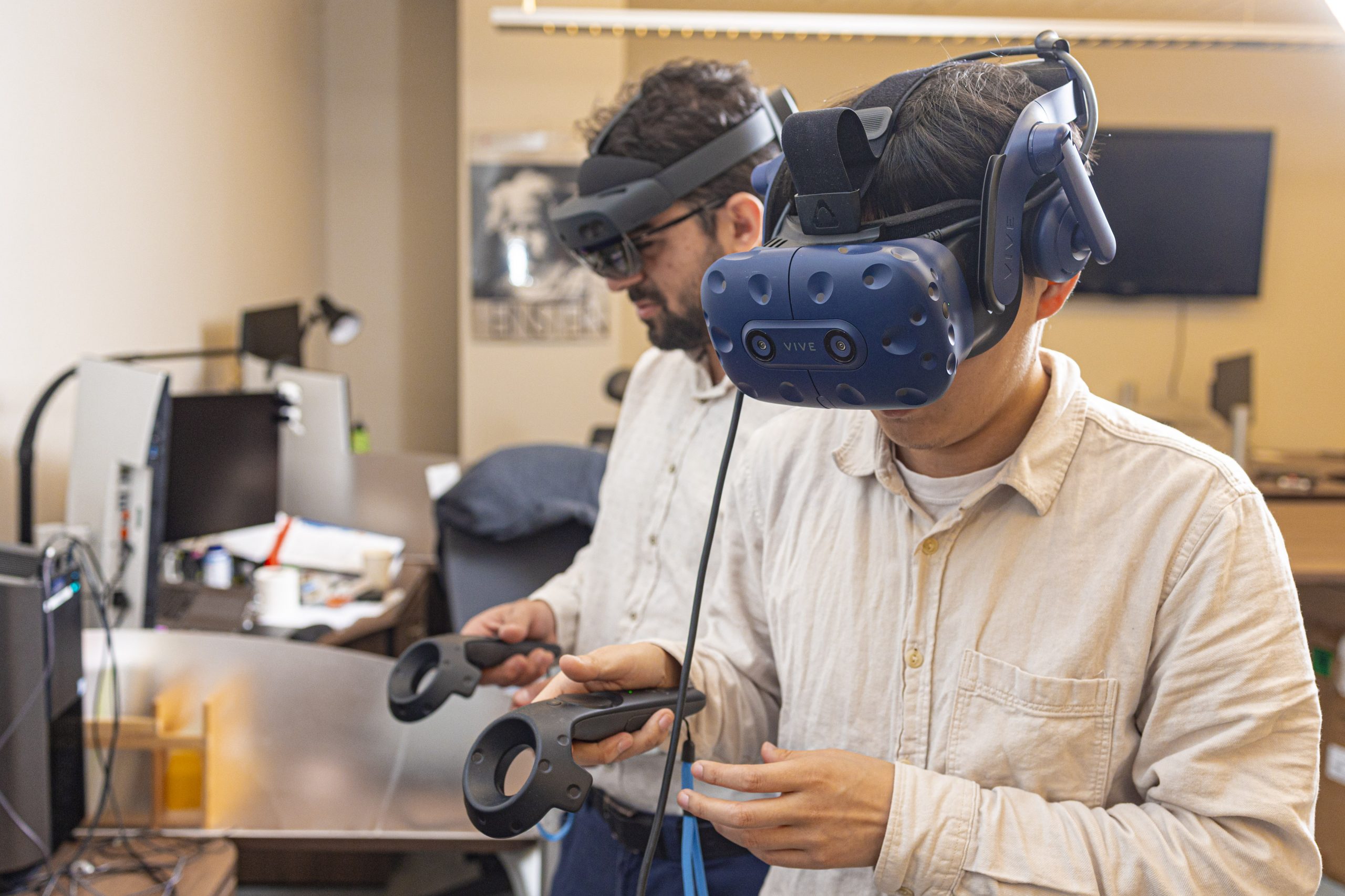 graduate students wearing virtual reality headsets